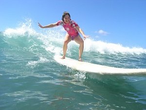 surfing lesson waikiki pink rashguard yelp pic